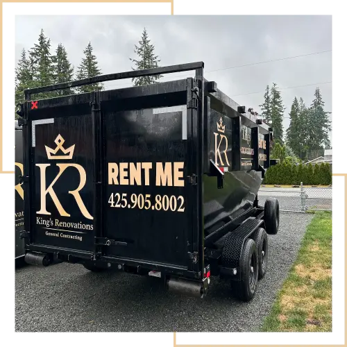 View of the back of a rental dmpster, parked in a client's driveway.